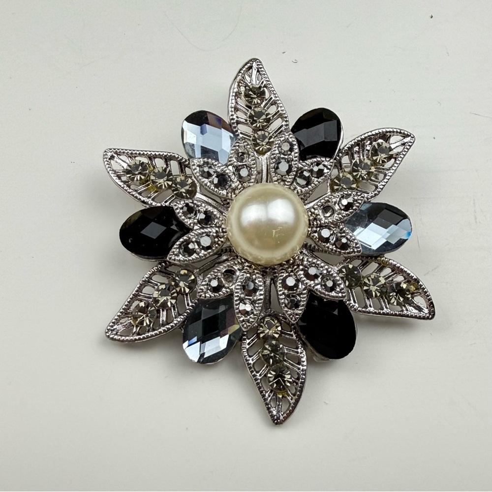 Elegant Silver and Black Floral Brooch